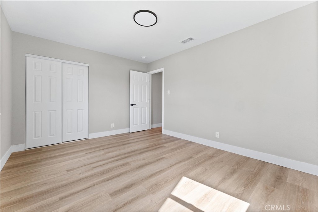 8039 4th Street Downey, CA 90241 - Photo 17 of 26 a view of an empty room and wooden floor