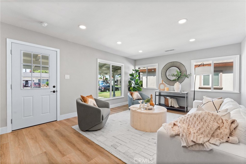 8039 4th Street Downey, CA 90241 - Photo 2 of 26 a living room with furniture and a window