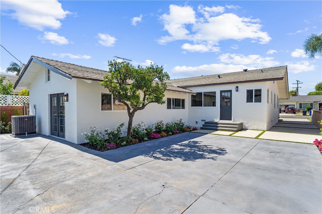 8039 4th Street Downey, CA 90241 - Photo 26 of 26 a view of a house with backyard and a tree
