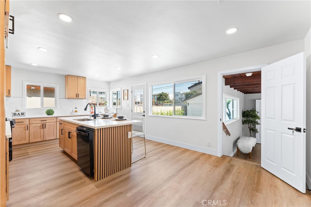 8039 4th Street Downey, CA 90241 - Photo 9 of 26 a kitchen with a sink and a stove top oven
