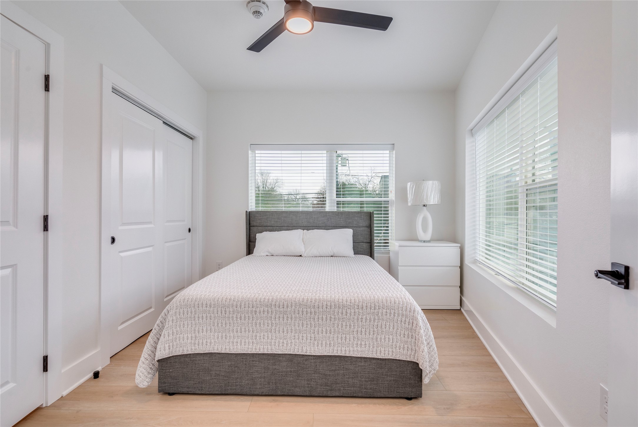 3000 Duval Street, Unit 207 Austin, TX 78705 - Photo 12 of 34 a bedroom with a large bed and a large window