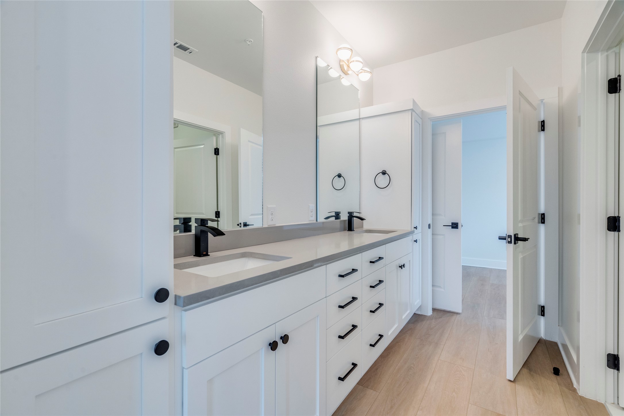 3000 Duval Street, Unit 207 Austin, TX 78705 - Photo 14 of 34 a bathroom with a double vanity sink mirror and shower