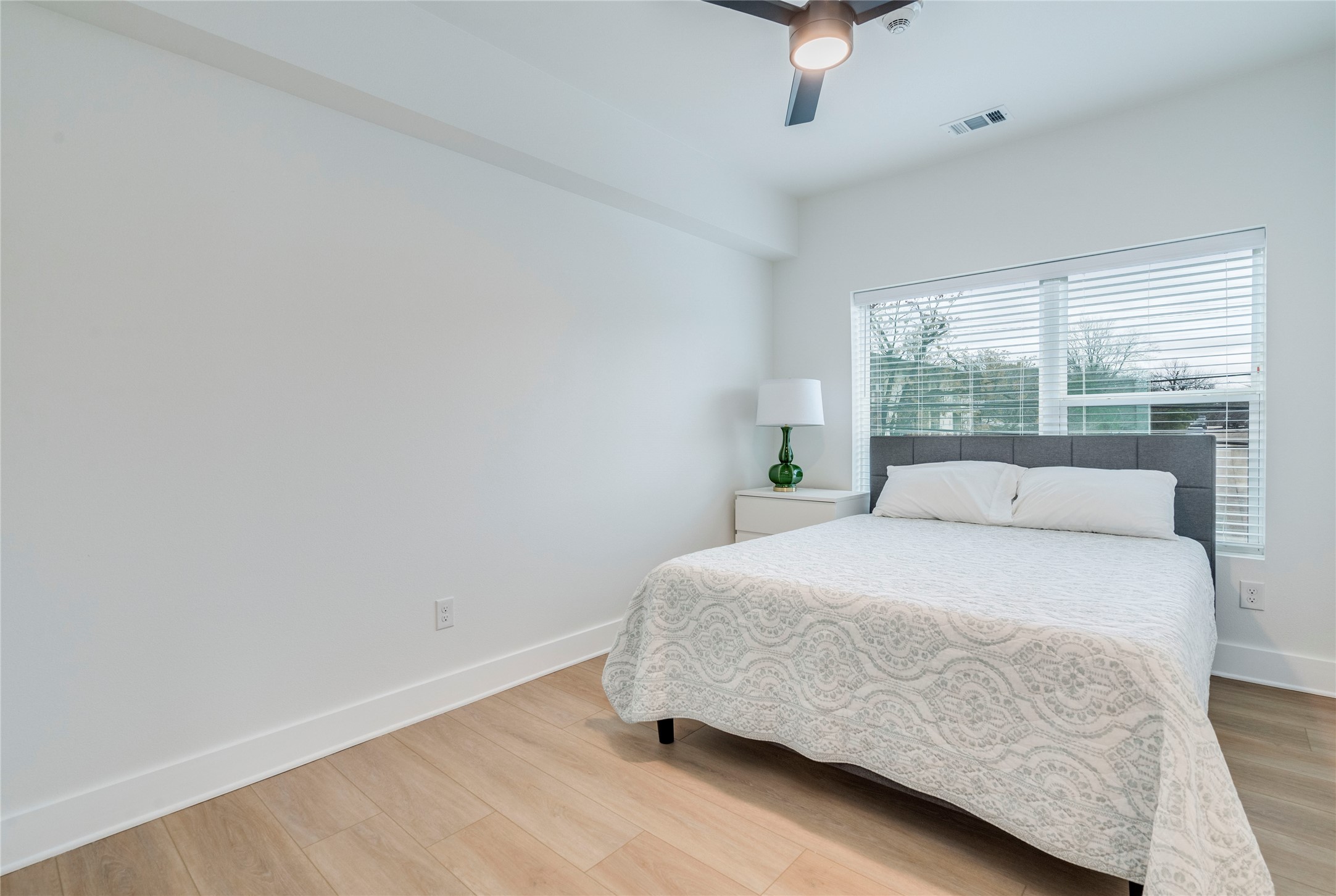 3000 Duval Street, Unit 207 Austin, TX 78705 - Photo 16 of 34 a bedroom with a bed and window