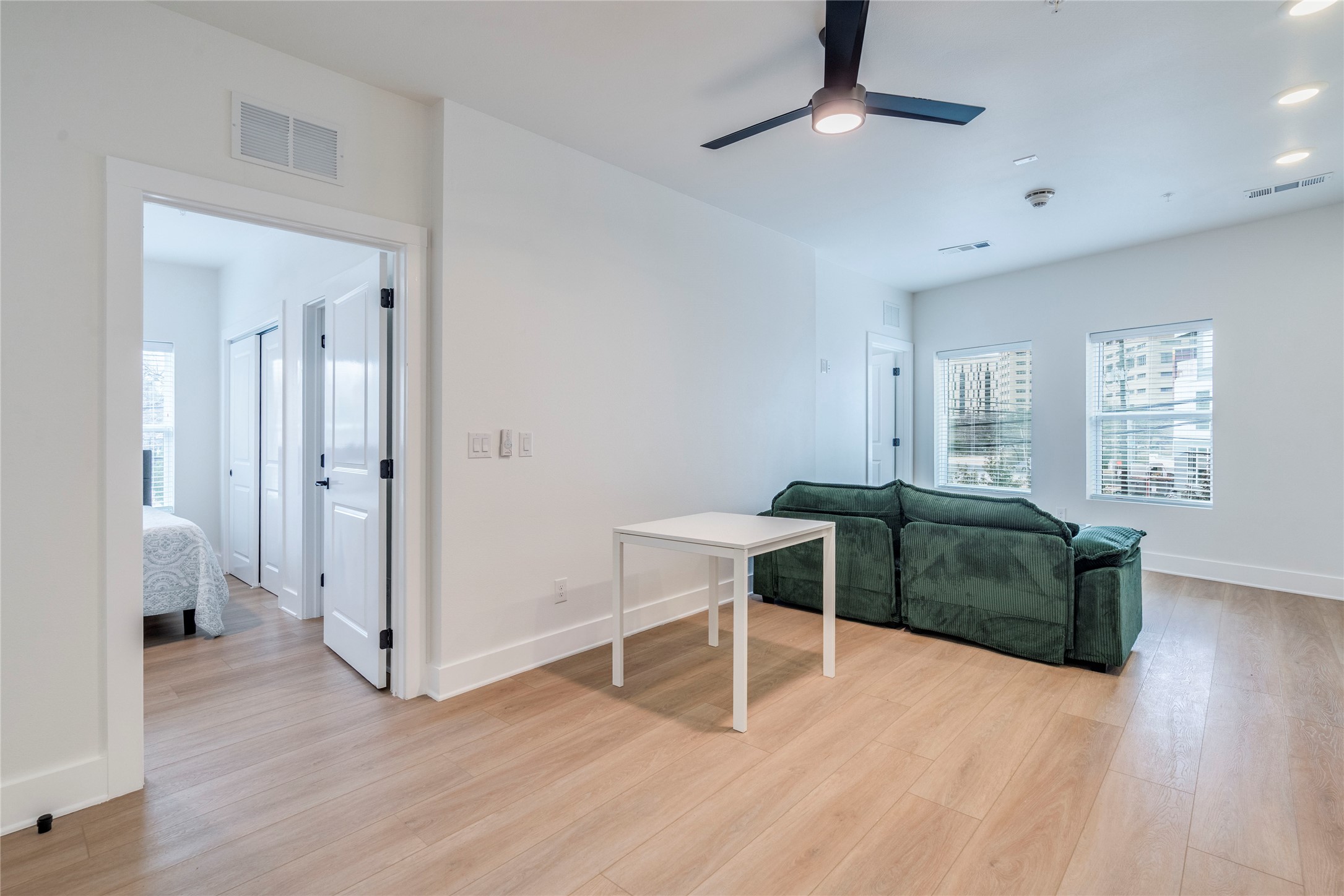 3000 Duval Street, Unit 207 Austin, TX 78705 - Photo 5 of 34 a view of a livingroom with furniture and wooden floor