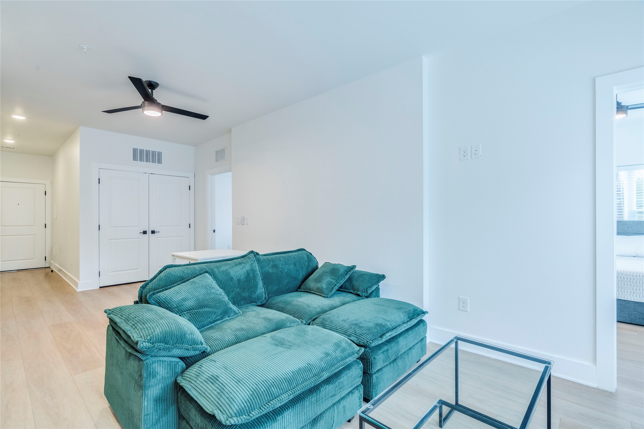 3000 Duval Street, Unit 207 Austin, TX 78705 - Photo 6 of 34 a living room with furniture and a ceiling fan