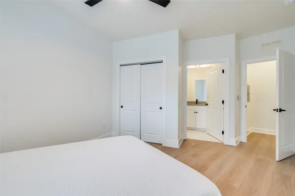 a bedroom with a bed and a bathroom