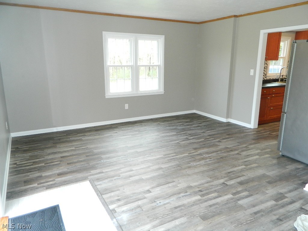 8675 Wilson Mills Road Chesterland, OH 44026 - Photo 8 of 23 Family Room/Dining Room with Sliding Door Out to a Paver Patio with Fire Pit and Water Feature