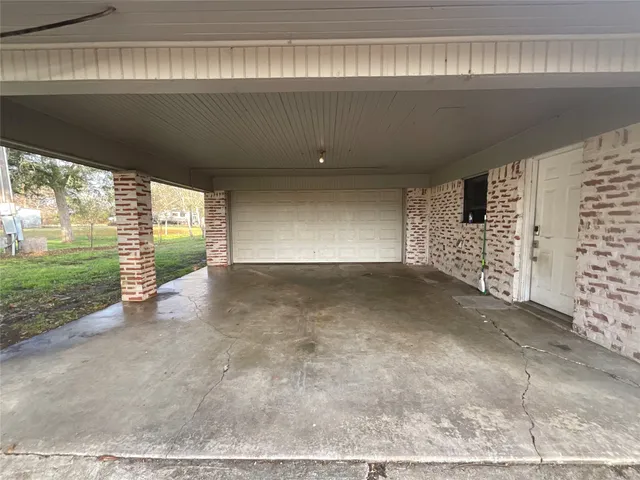 a view of a refrigerator and wooden floor