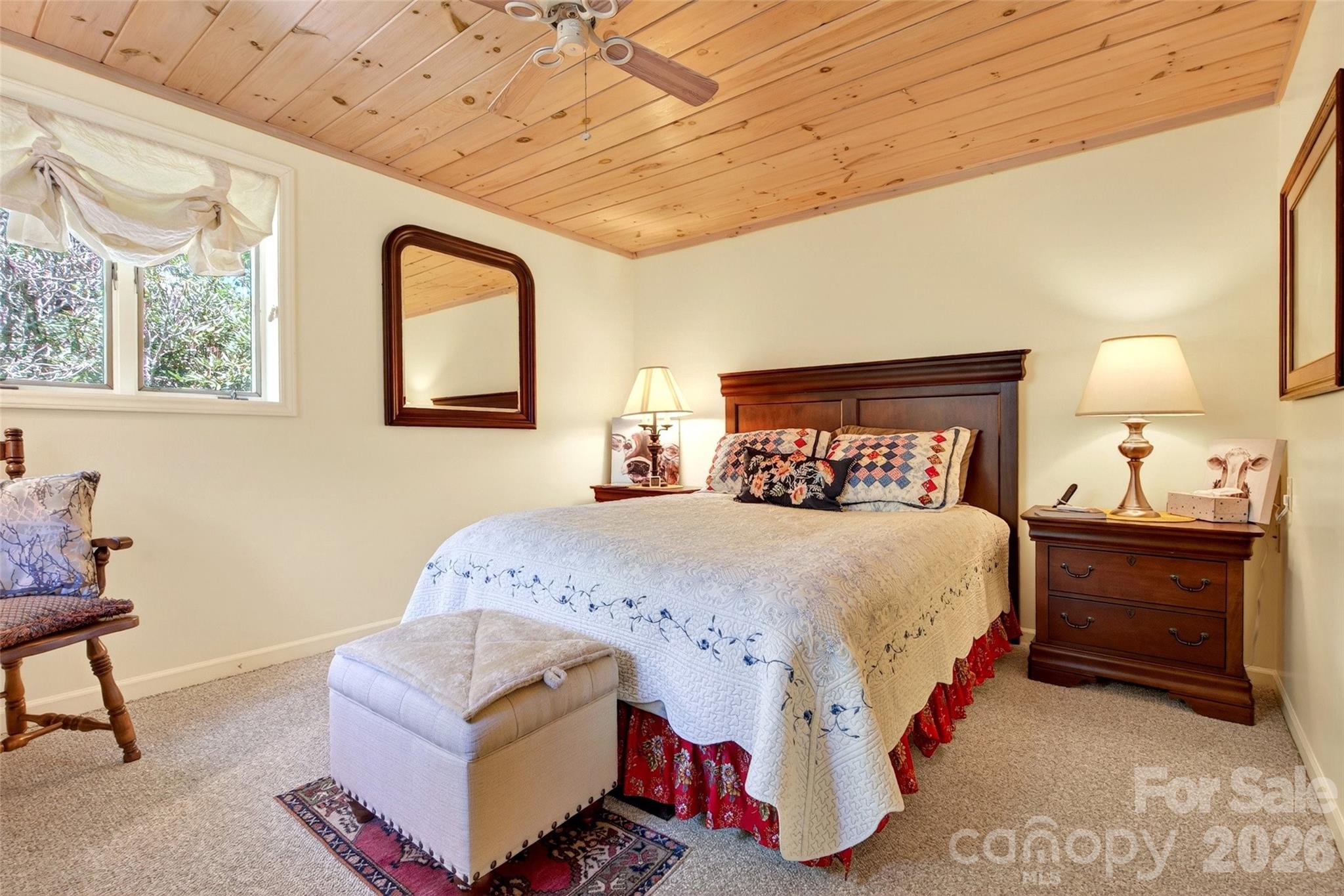 334 Harbor Lake Road Newland, NC 28657 - Photo 31 of 48 a bed room with a bed and a chair