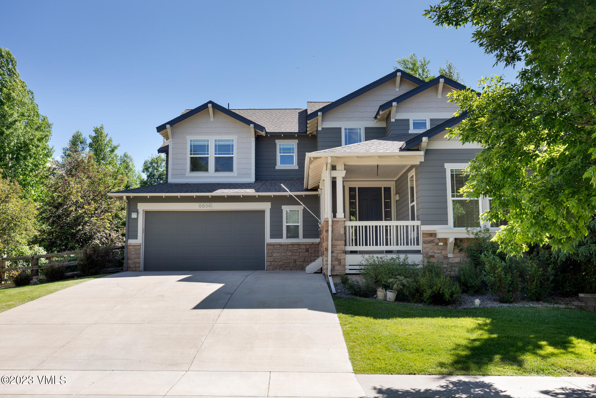 34 Greenhorn Avenue Eagle, CO 81631 - Photo 1 of 53 a front view of a house with a yard and trees