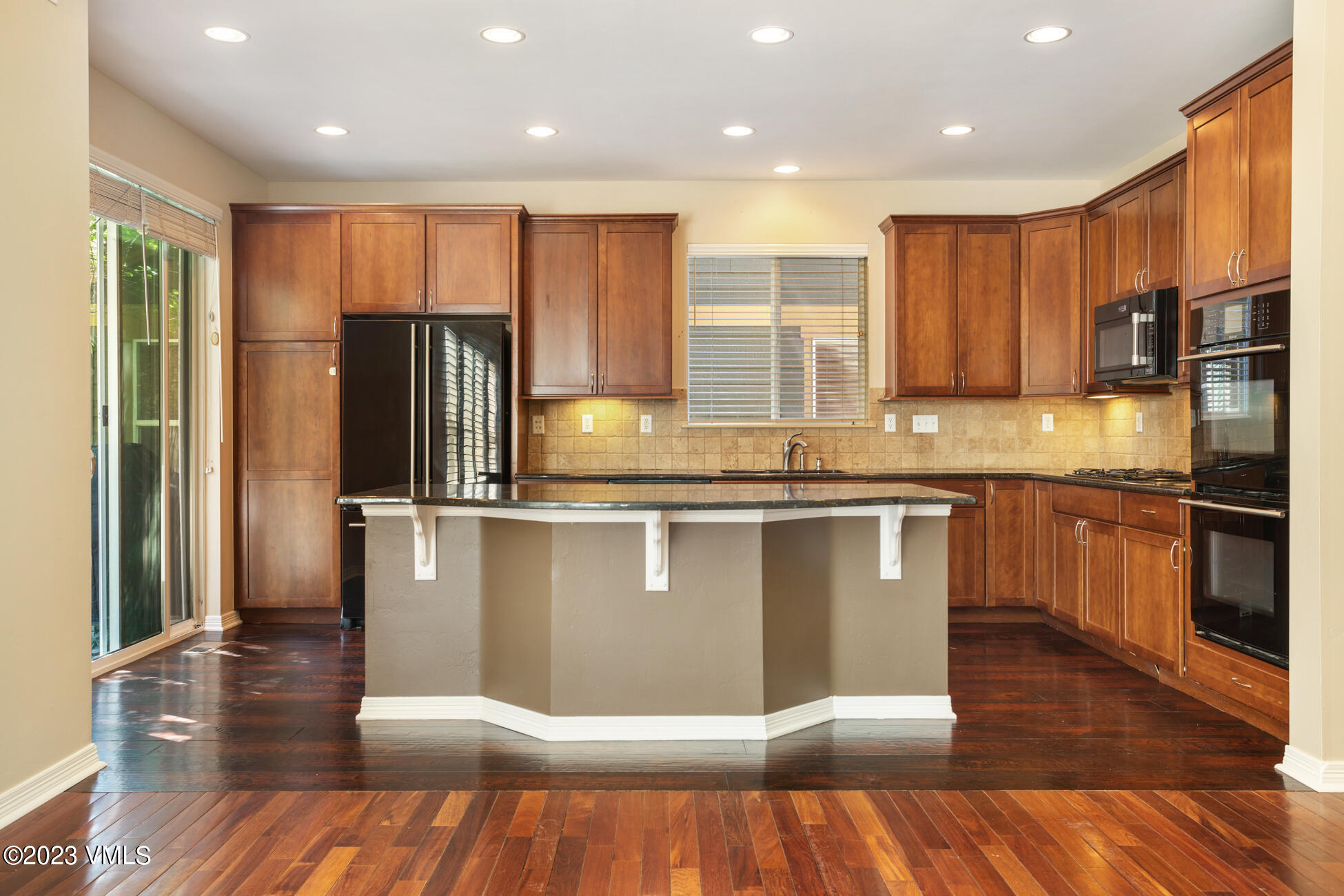 34 Greenhorn Avenue Eagle, CO 81631 - Photo 12 of 53 a kitchen with stainless steel appliances granite countertop a refrigerator a sink and a stove