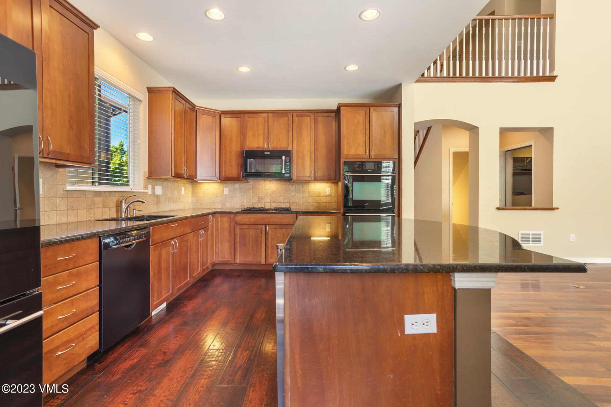 34 Greenhorn Avenue Eagle, CO 81631 - Photo 14 of 53 a kitchen with stainless steel appliances granite countertop a sink a stove and a refrigerator