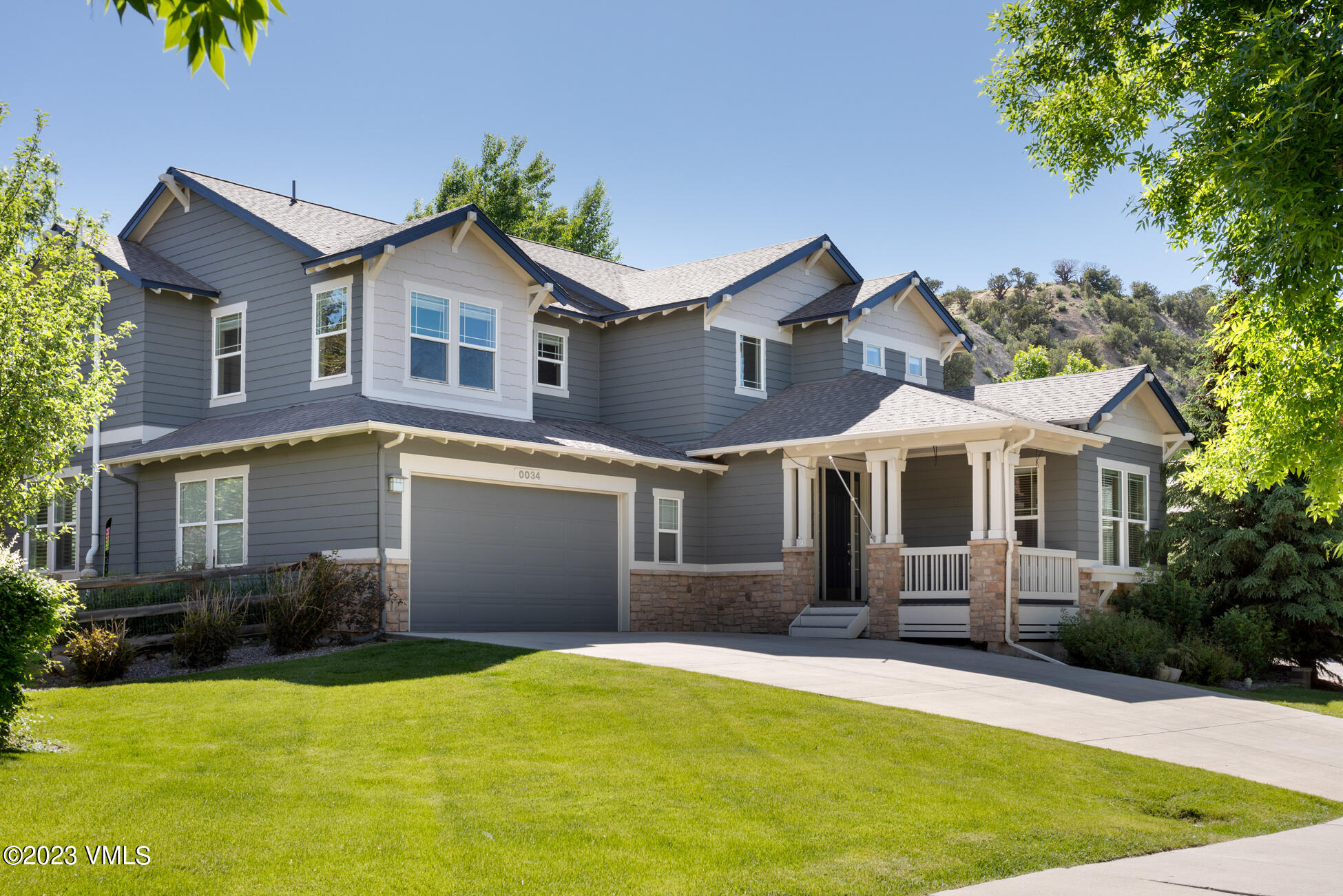 34 Greenhorn Avenue Eagle, CO 81631 - Photo 2 of 53 a front view of a house with yard and garage