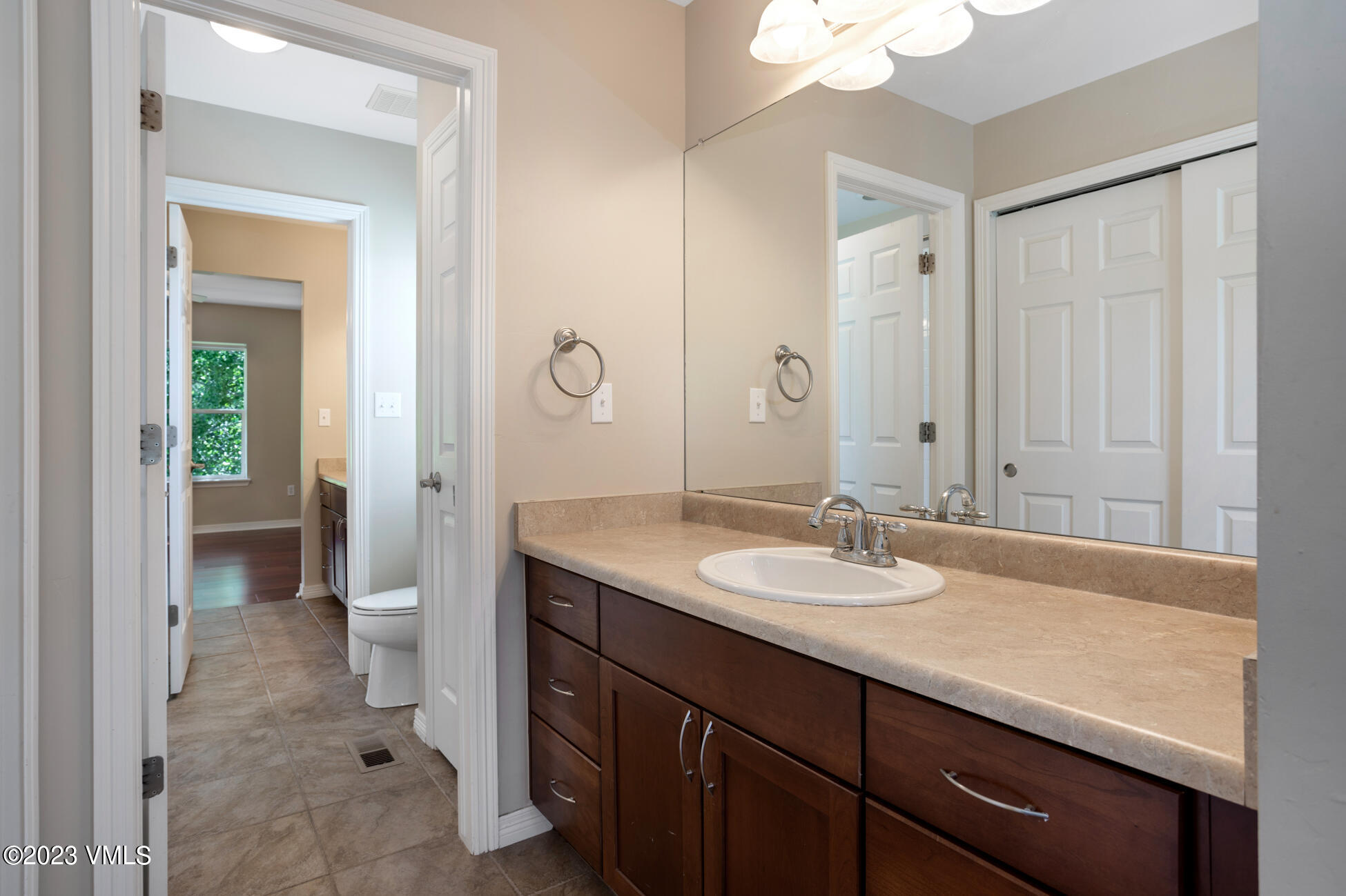 34 Greenhorn Avenue Eagle, CO 81631 - Photo 32 of 53 a bathroom with a granite countertop sink a toilet and a mirror
