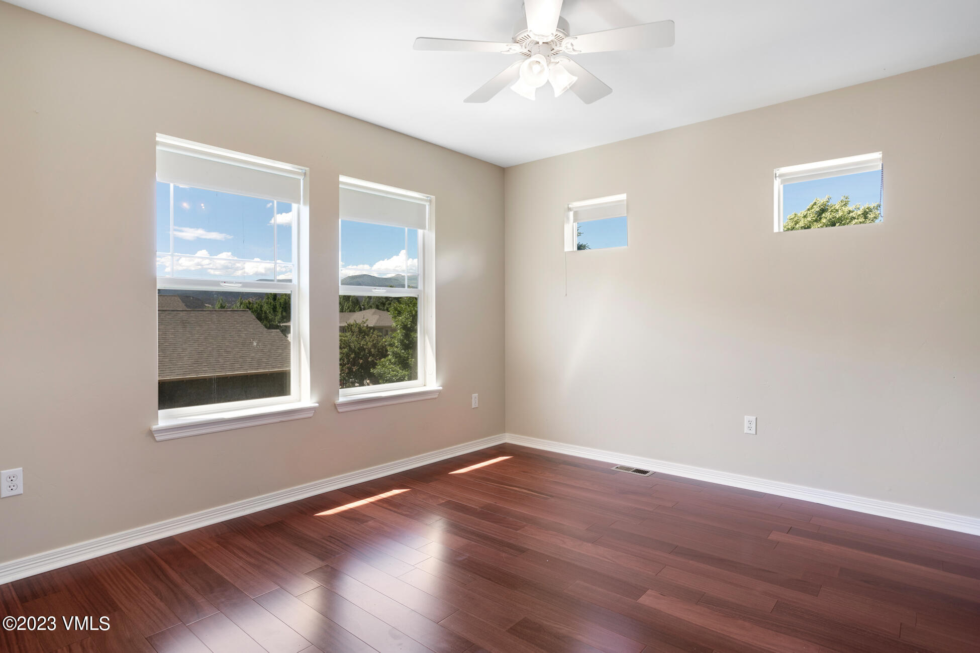 34 Greenhorn Avenue Eagle, CO 81631 - Photo 34 of 53 a view of an empty room with wooden floor and a window