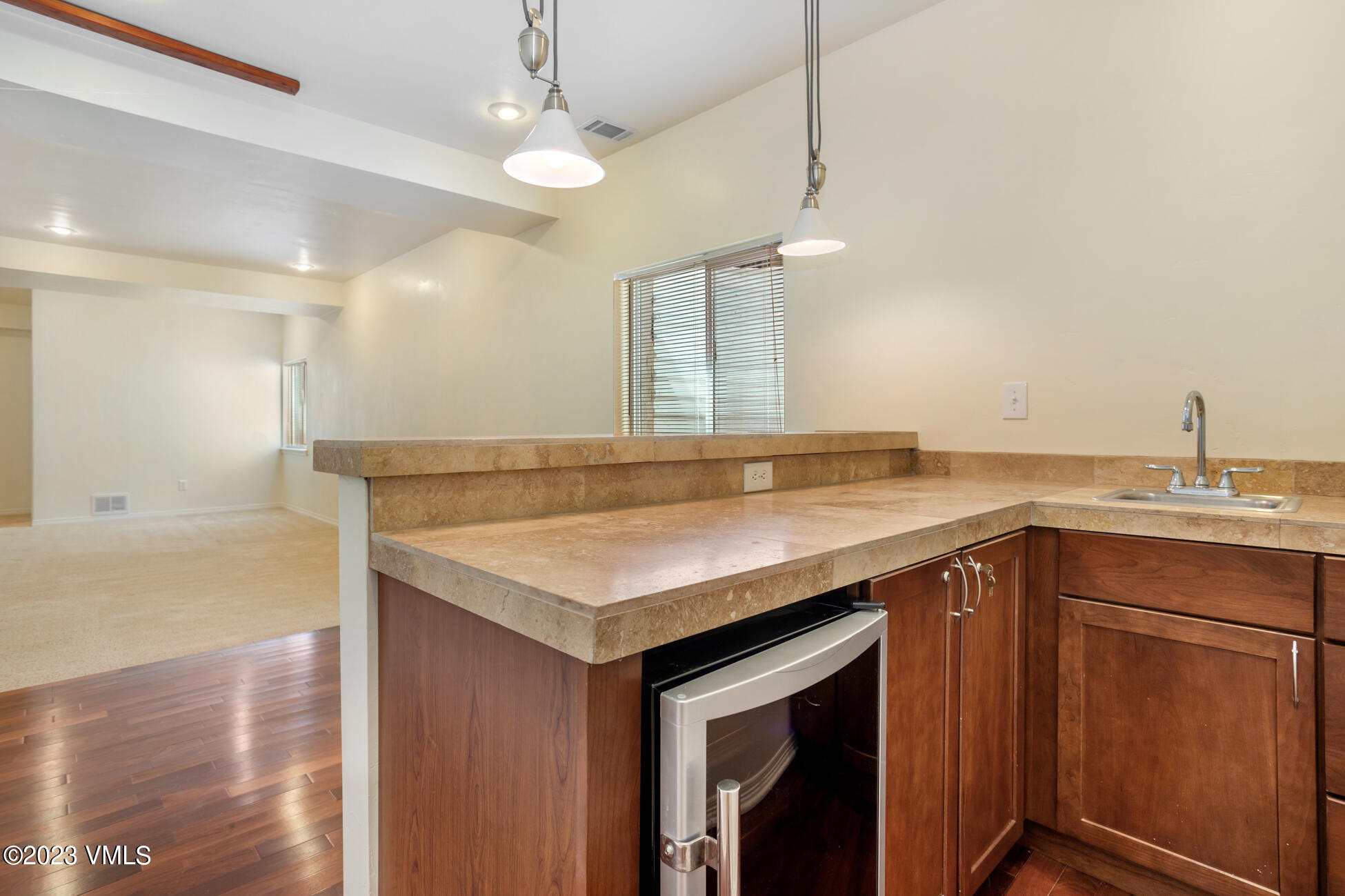 34 Greenhorn Avenue Eagle, CO 81631 - Photo 40 of 53 a kitchen with a sink a counter space and wooden floor