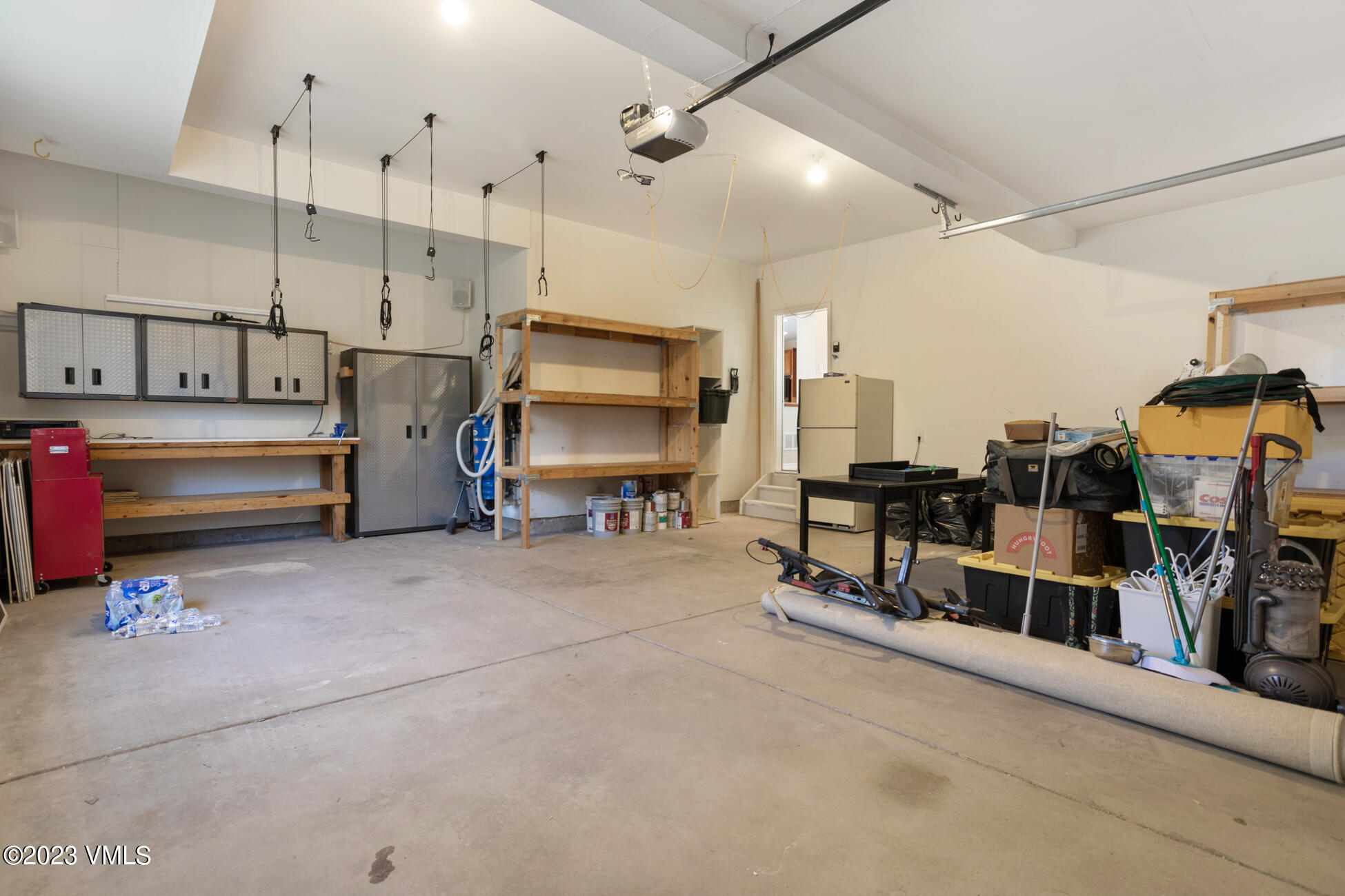 34 Greenhorn Avenue Eagle, CO 81631 - Photo 45 of 53 a utility room with multiple dryer and toys