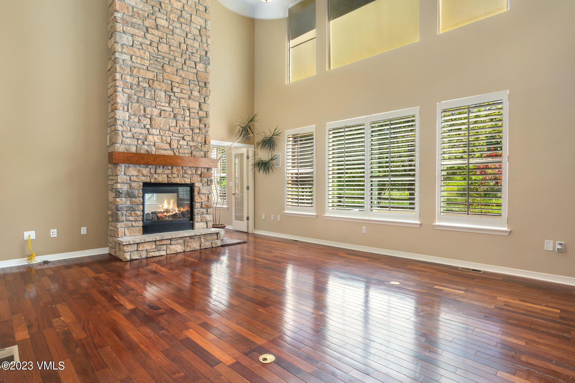 34 Greenhorn Avenue Eagle, CO 81631 - Photo 7 of 53 a view of an empty room with wooden floor and a fireplace