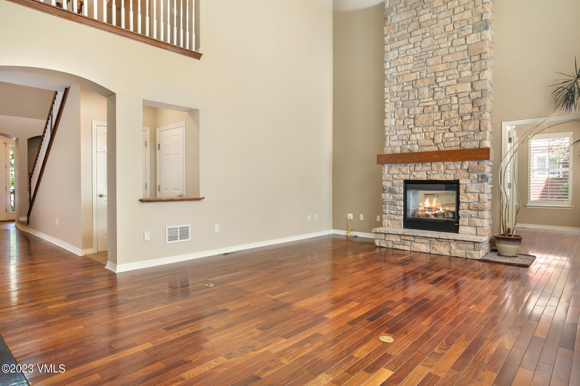 34 Greenhorn Avenue Eagle, CO 81631 - Photo 9 of 53 a view of an empty room with wooden floor and a fireplace