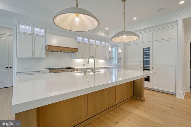 a view of a room with wooden floor and cabinet