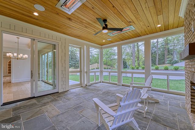 a view of a room window and wooden floor