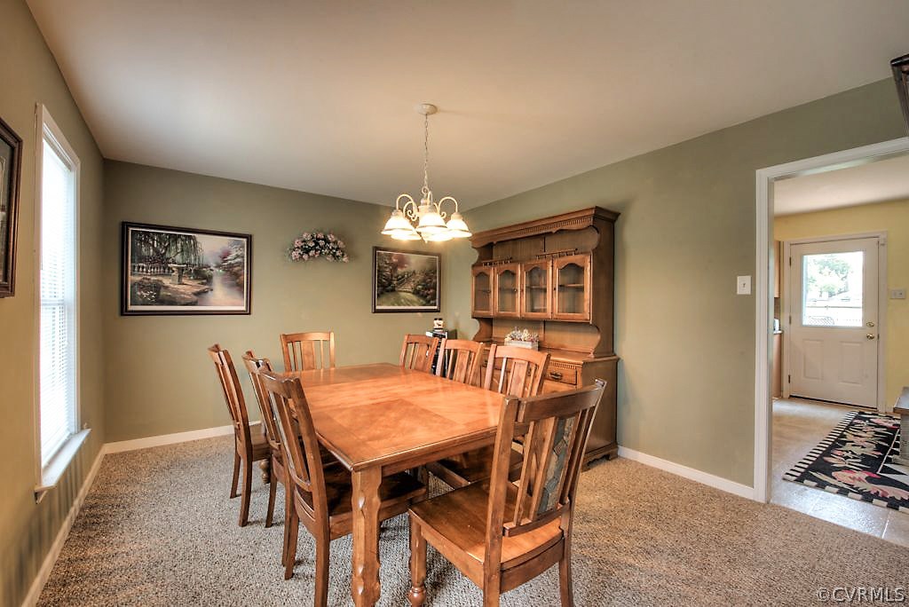 3501 Pease Road Midlothian, VA 23112 - Photo 8 of 42 a view of a dining room with furniture and chandelier