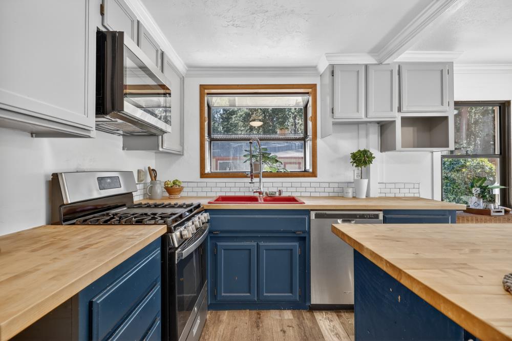 2925 Maple Avenue Pollock Pines, CA 95726 - Photo 20 of 42 a kitchen with stainless steel appliances granite countertop a sink stove and cabinets