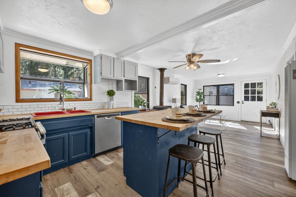 2925 Maple Avenue Pollock Pines, CA 95726 - Photo 21 of 42 a kitchen with a sink and wooden cabinets