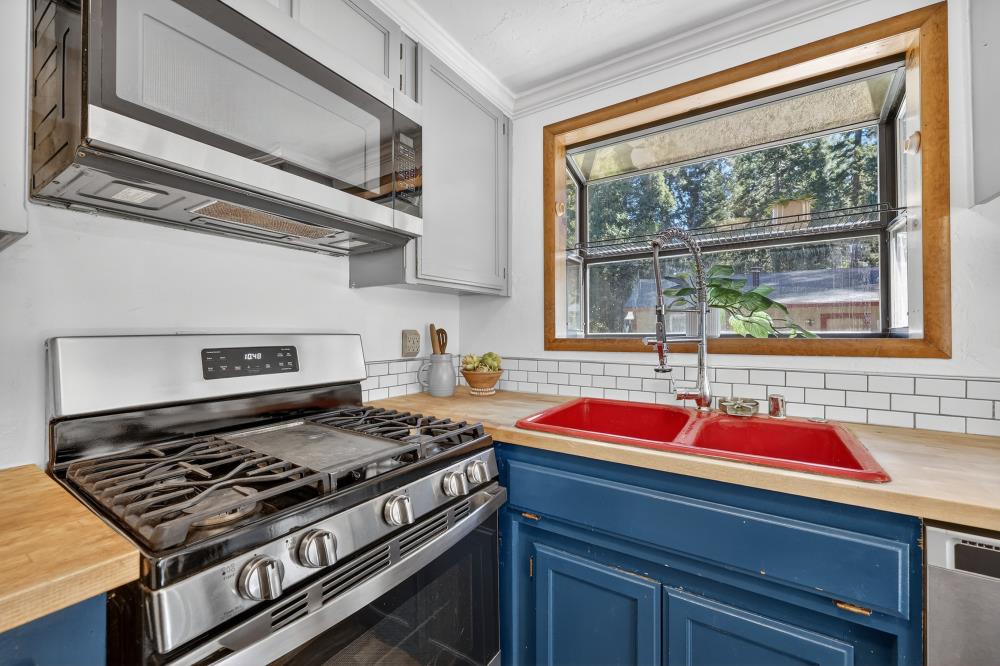 2925 Maple Avenue Pollock Pines, CA 95726 - Photo 22 of 42 a kitchen with a stove and a sink