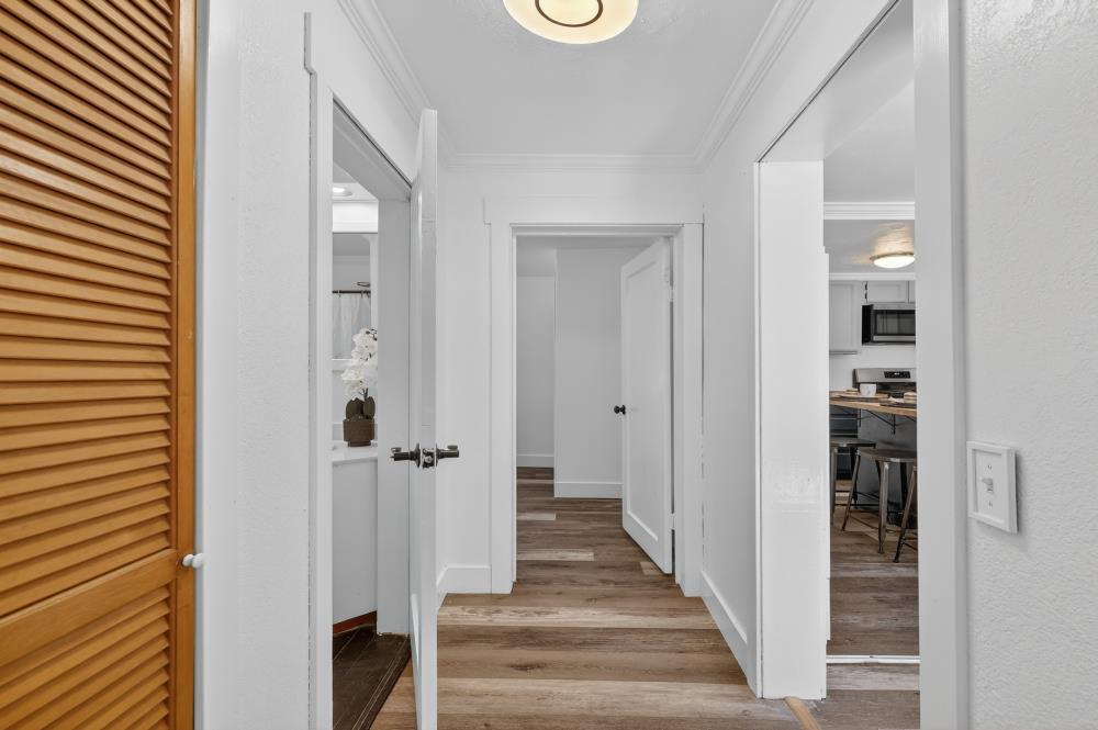 2925 Maple Avenue Pollock Pines, CA 95726 - Photo 27 of 42 a view of a hallway with wooden floor and staircase