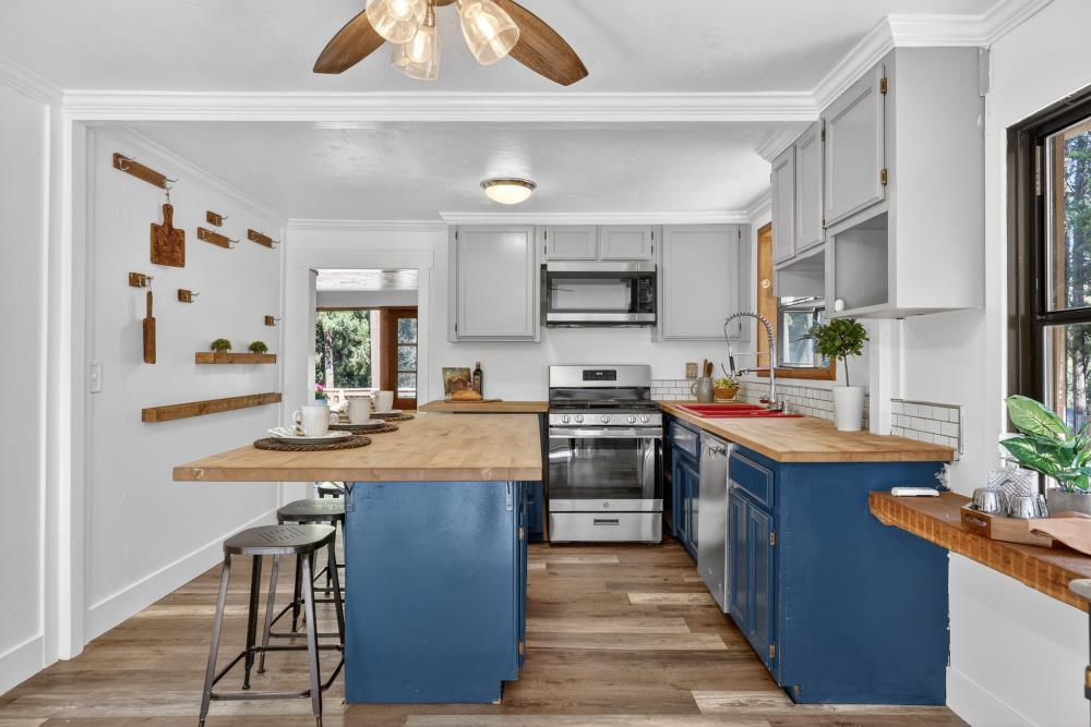 2925 Maple Avenue Pollock Pines, CA 95726 - Photo 6 of 42 a kitchen with stainless steel appliances granite countertop a sink stove and refrigerator