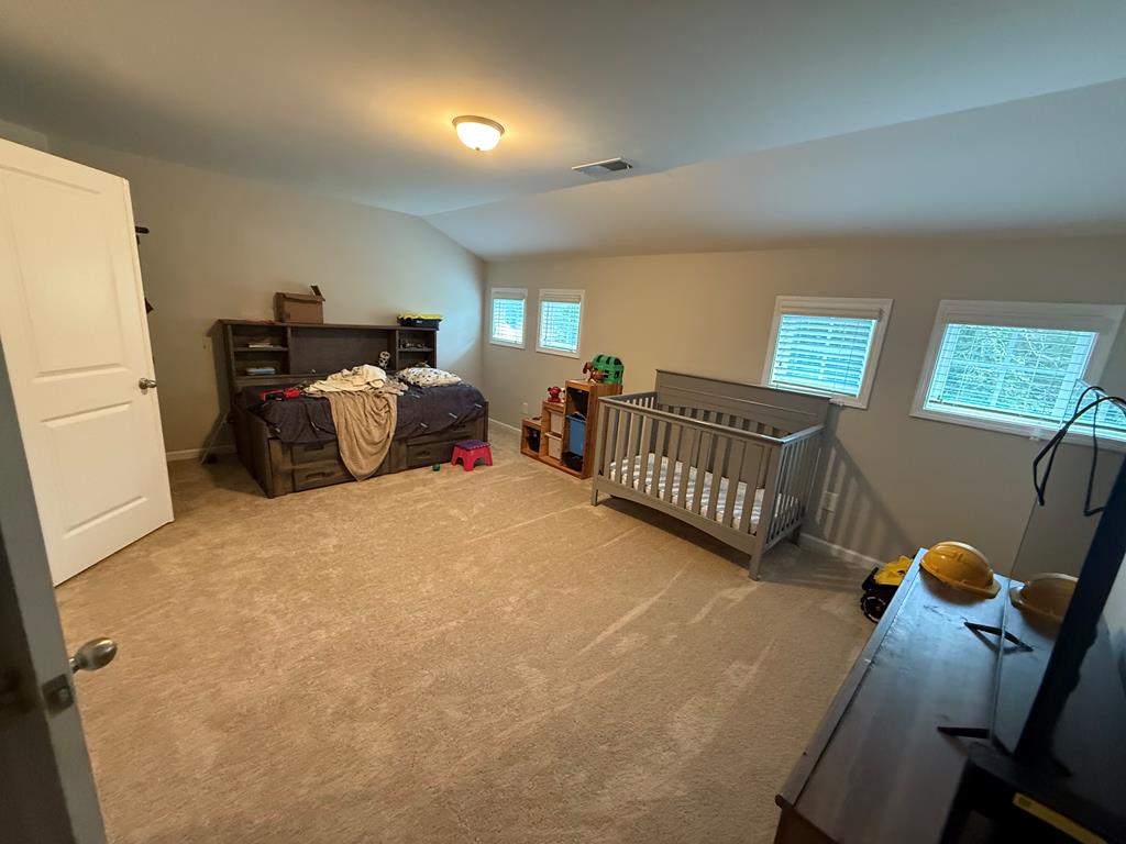 57 Hart Ridge Court Fortson, GA 31808 - Photo 19 of 38 a bedroom with furniture and a window