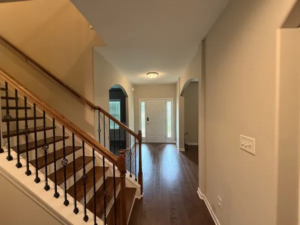 a view of entryway with wooden floor