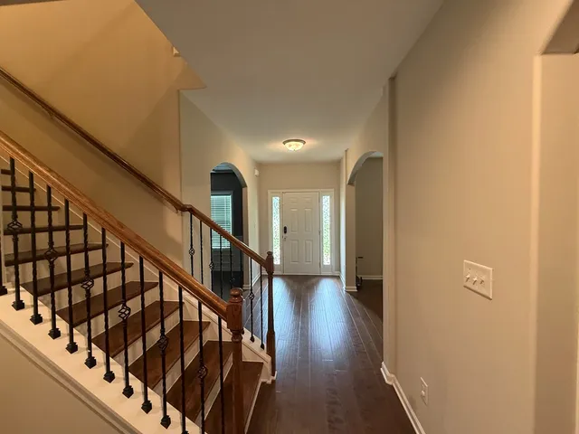 a view of entryway with wooden floor