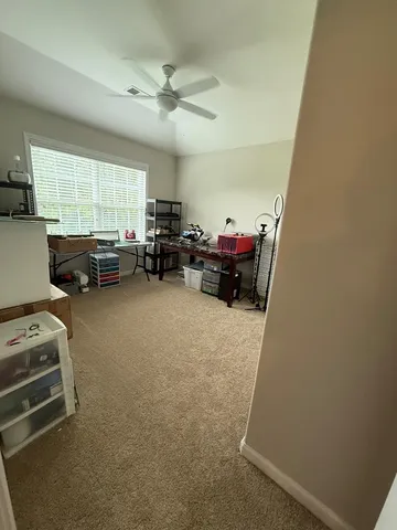 a bed sitting in a room next to a window