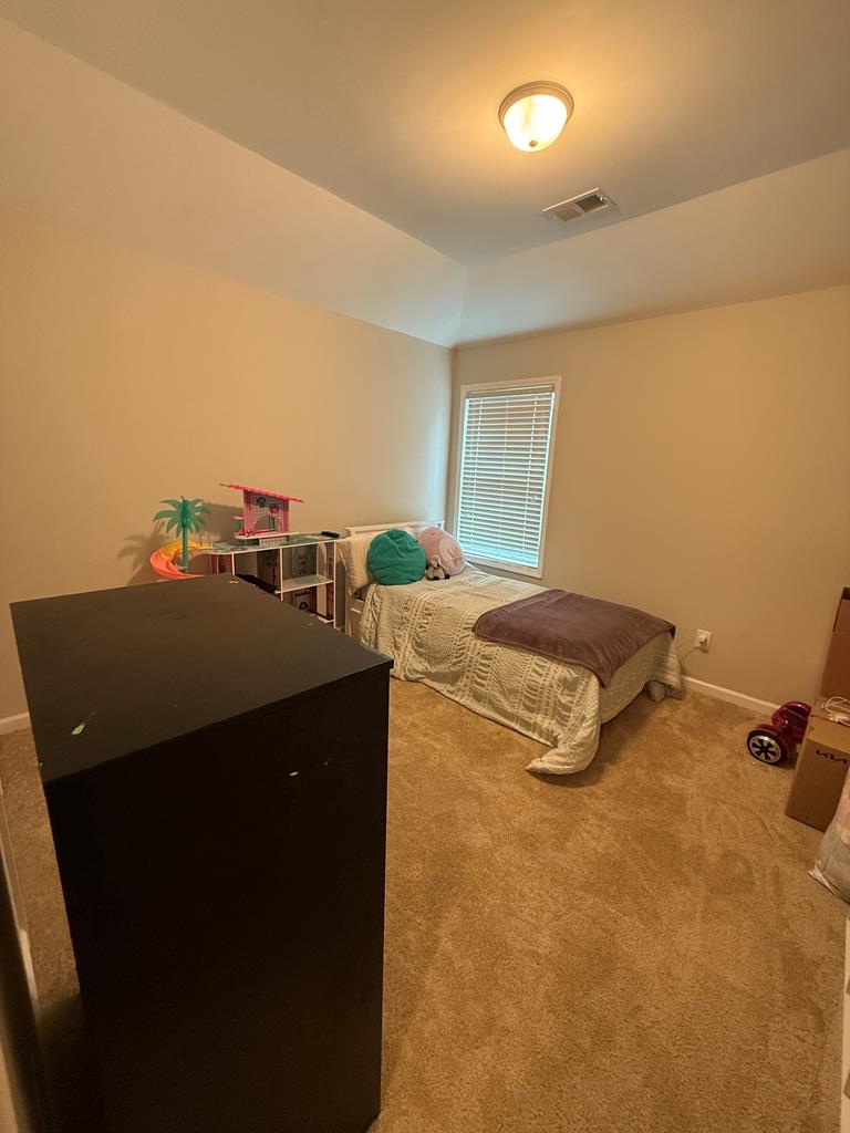 57 Hart Ridge Court Fortson, GA 31808 - Photo 24 of 38 a bed sitting in a room next to a window