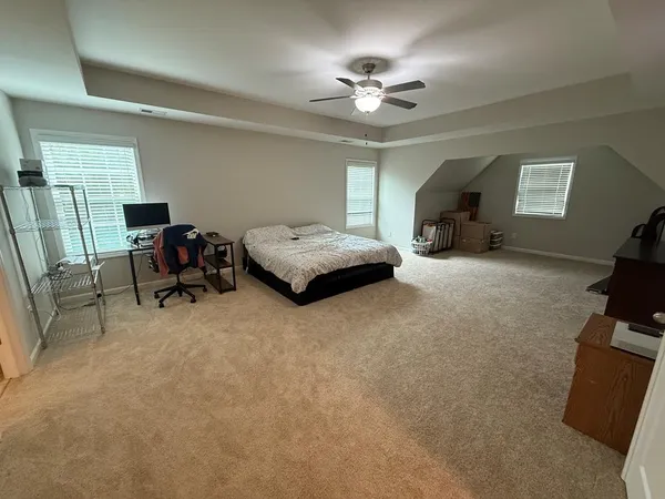 a view of workspace with furniture and window
