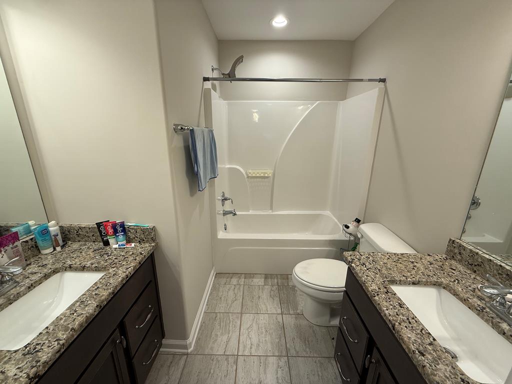57 Hart Ridge Court Fortson, GA 31808 - Photo 35 of 38 a bathroom with a granite countertop sink toilet and shower