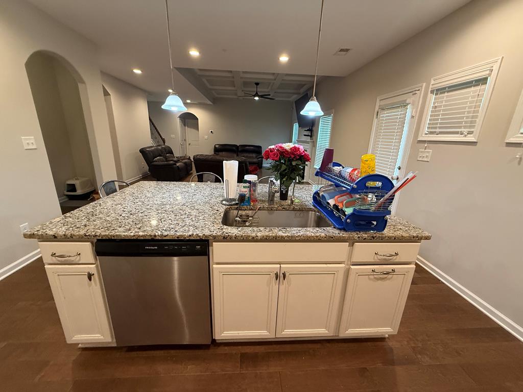 57 Hart Ridge Court Fortson, GA 31808 - Photo 8 of 38 a kitchen with granite countertop a sink cabinets and wooden floor