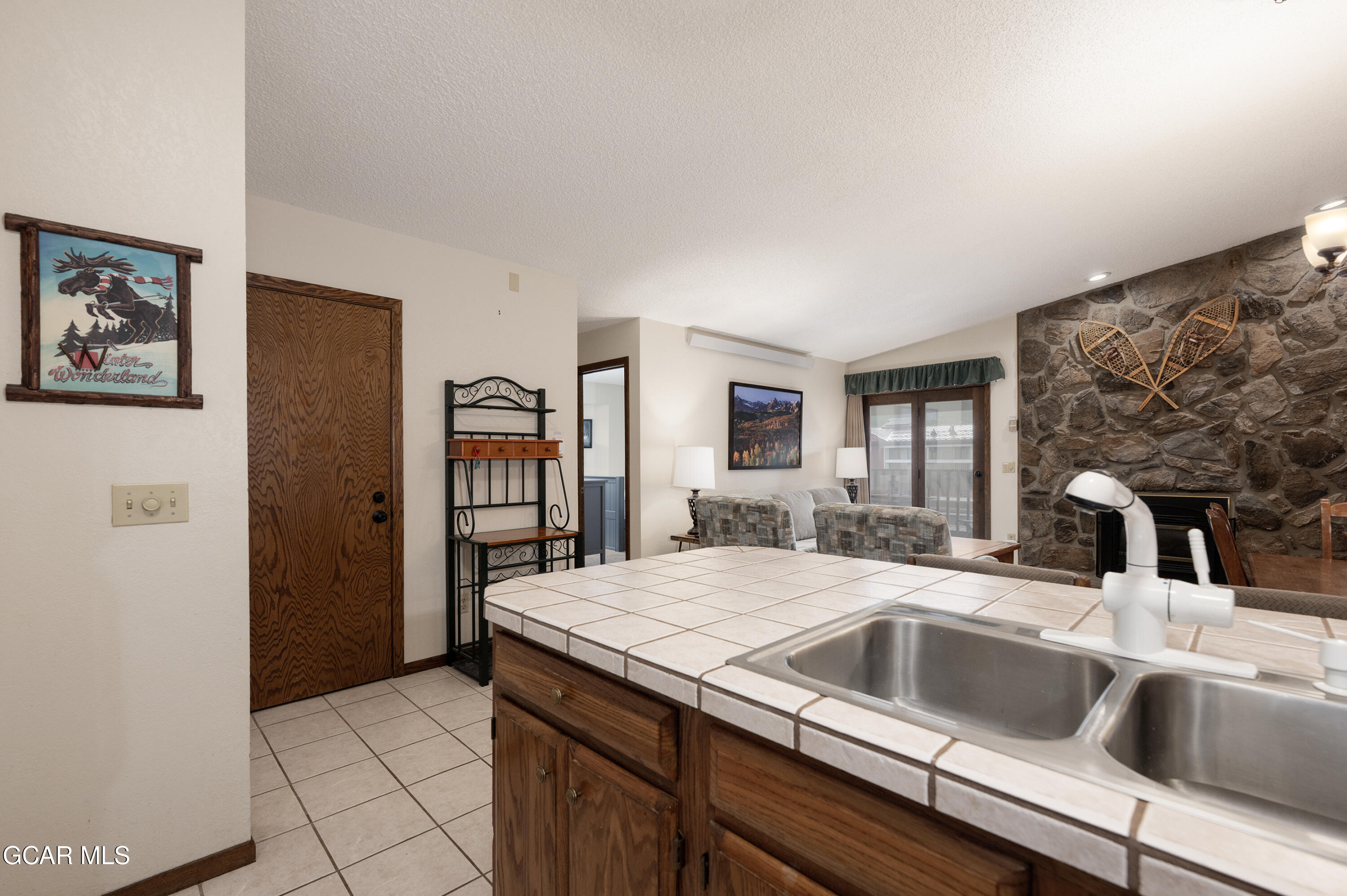 490 Kings Crossing Road, Unit 331 Winter Park, CO 80482 - Photo 9 of 38 a kitchen with a sink and a refrigerator