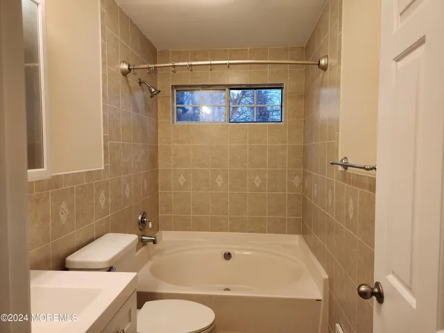 a bathroom with a sink and a bathtub