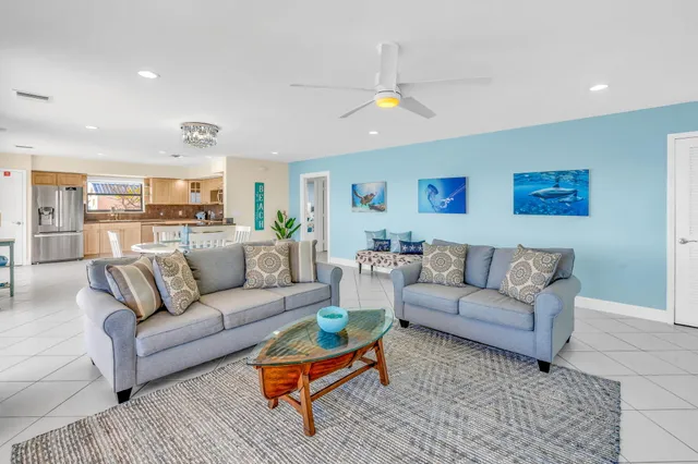 a spacious bathroom with a granite countertop sink a mirror and a shower