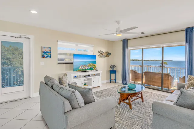 a bathroom with a granite countertop double vanity sink and a mirror
