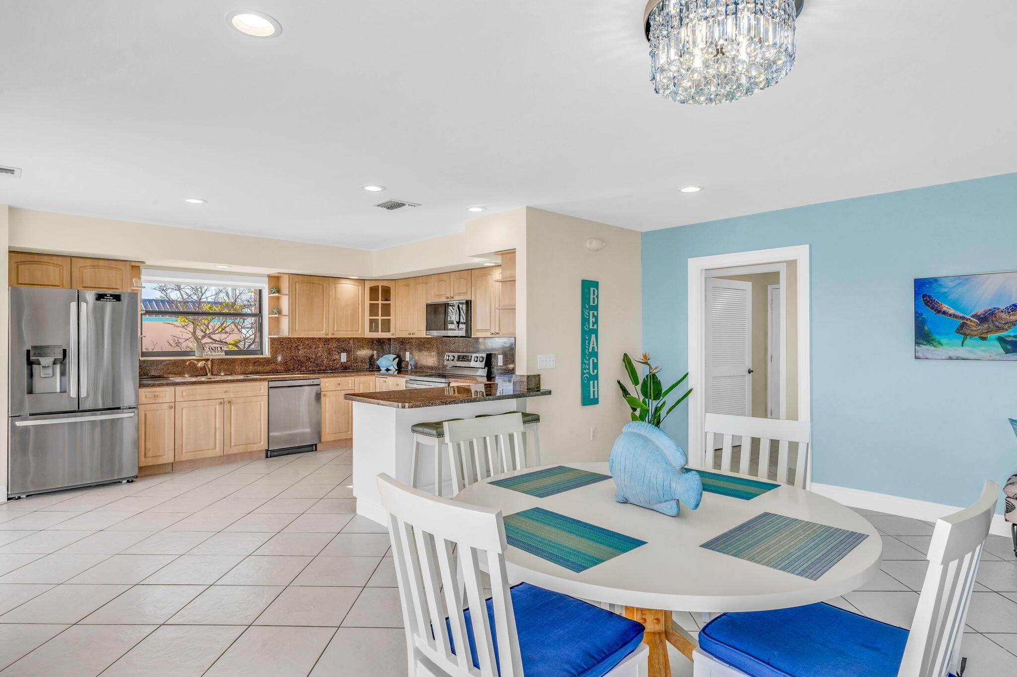 33 Kyle Way West Marathon, FL 33050 - Photo 13 of 44 a open kitchen with white cabinets and stainless steel appliances