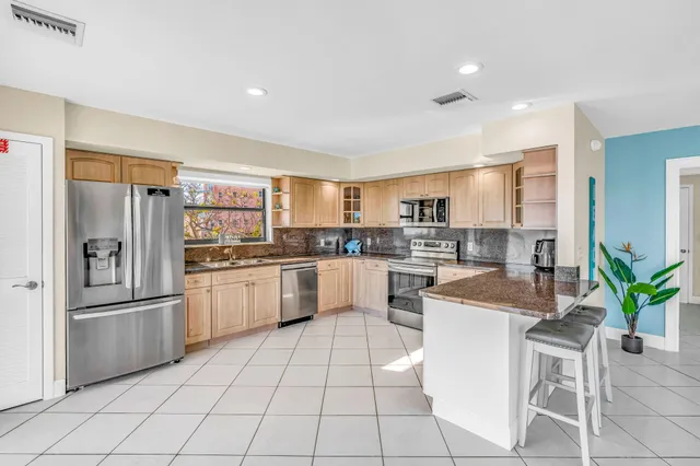 a bedroom with a bed and a dresser in it