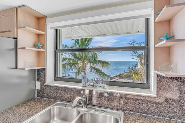 a bathroom with a toilet a sink and a mirror