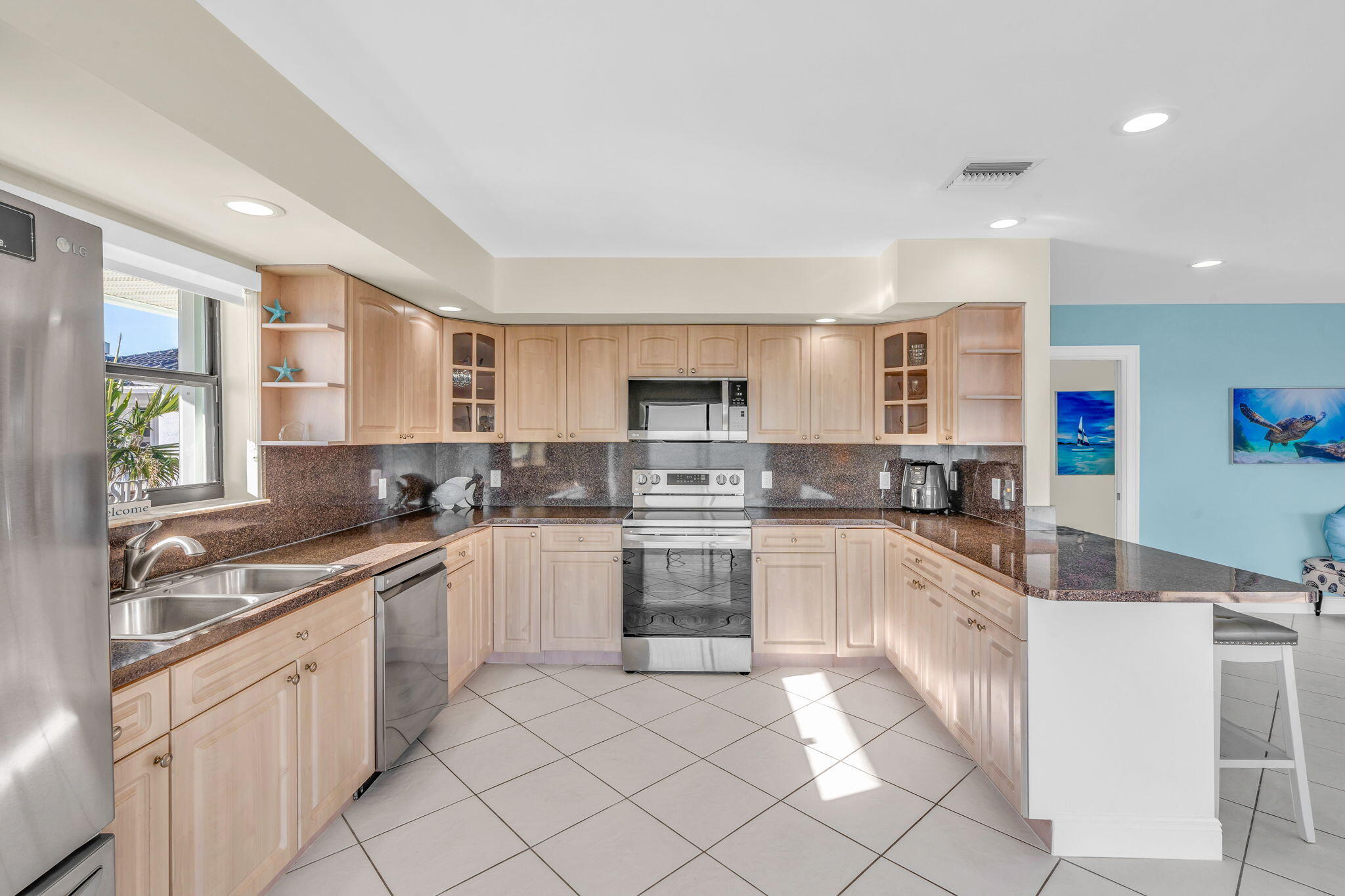 33 Kyle Way West Marathon, FL 33050 - Photo 16 of 44 a kitchen with granite countertop appliances cabinets and a sink