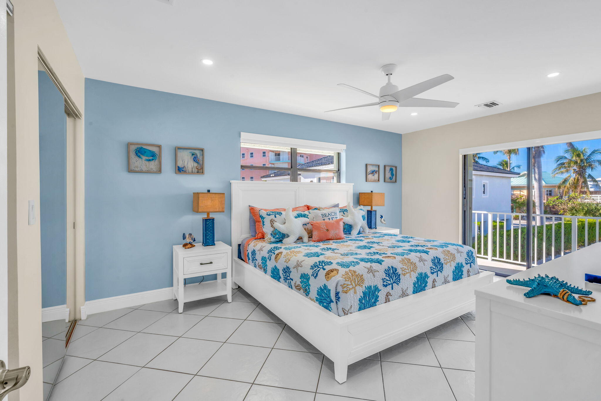 33 Kyle Way West Marathon, FL 33050 - Photo 17 of 44 a room with a bed and a chandelier