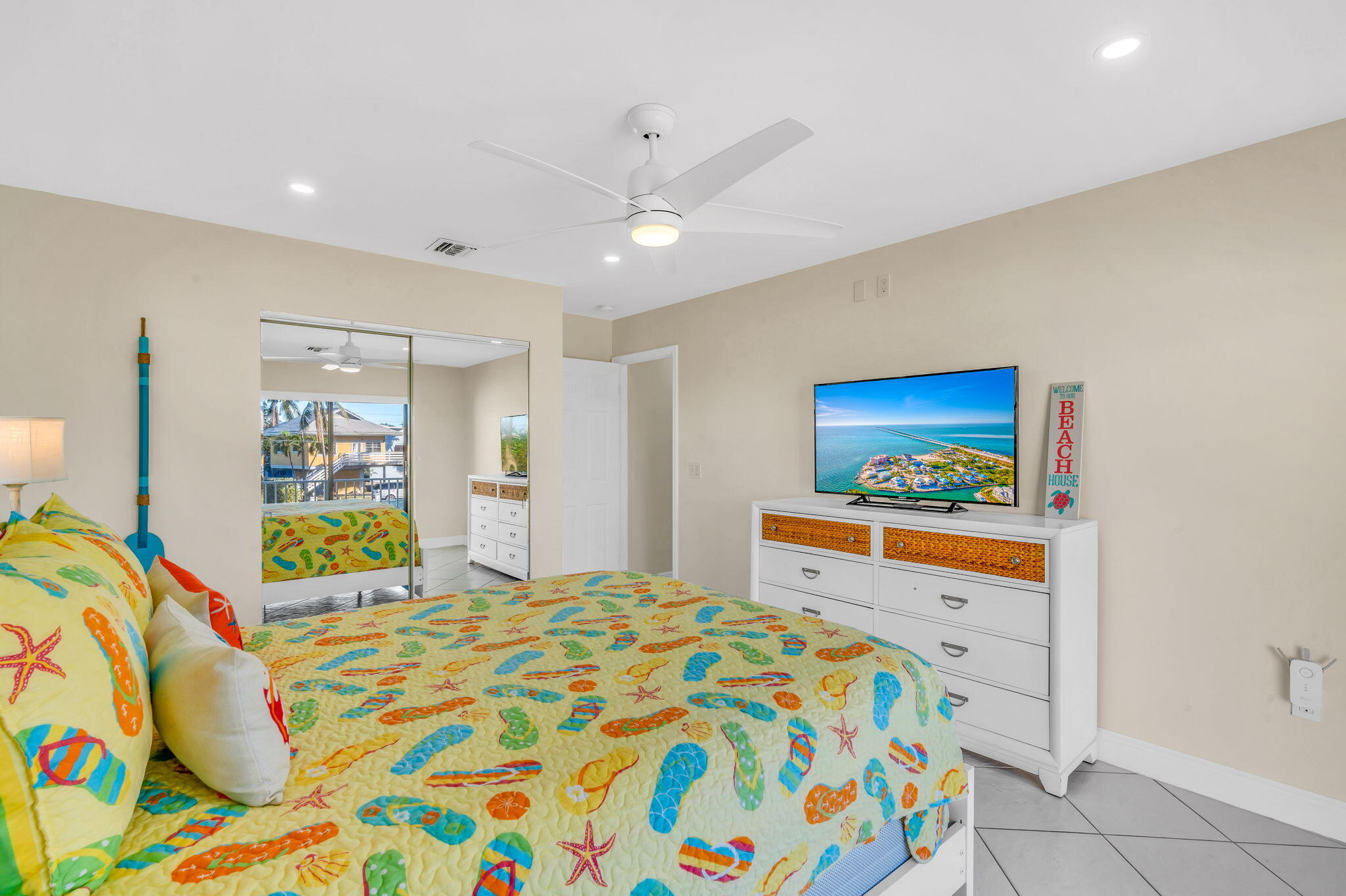 33 Kyle Way West Marathon, FL 33050 - Photo 22 of 44 a bedroom with a bed and a dresser in it
