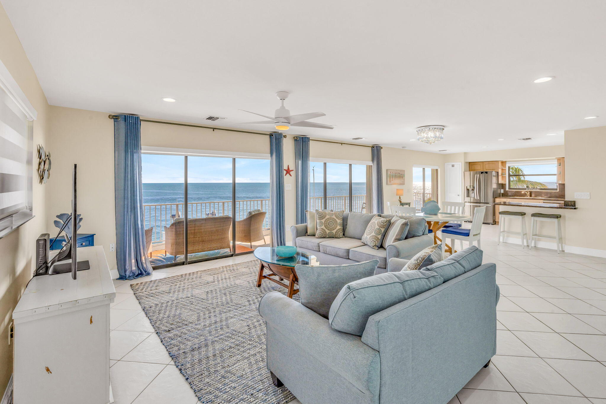 33 Kyle Way West Marathon, FL 33050 - Photo 8 of 44 a living room with furniture and a large window with outer view